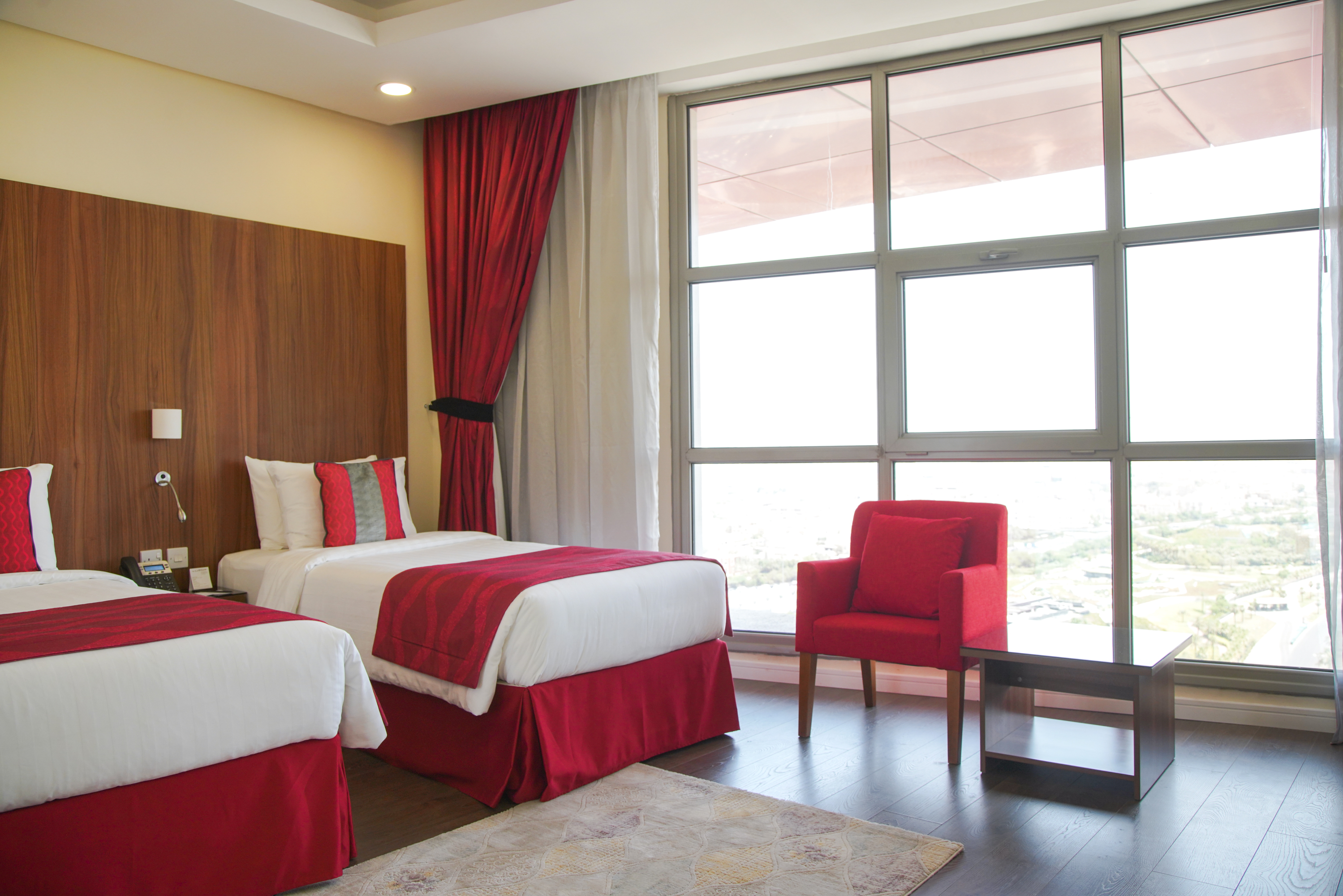 Guest room at the Ramada Encore by Wyndham Kuwait Downtown in Kuwait City, Other than US/Canada